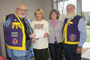 Ruth Pedherney, left, and Pam Stuffles of the Westport Public Library receive a cheque on behalf of the library. 