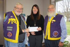 Rideau Vista Public School Principal, Teresa Polite, accepts a cheque for her school from the Lions Club. 