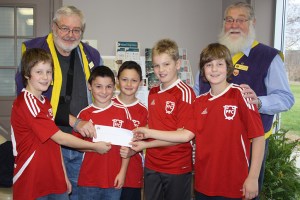 Portland Football Club members receive the cheque for their team. (L-R) Wesley Ewart, Cameron Scott, Brady Scott, Evan Rice, and Will Ewart. 