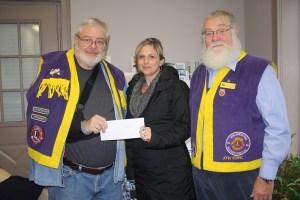 Niki Bresee receives a cheque for the North Leeds Minor Hockey Association. 